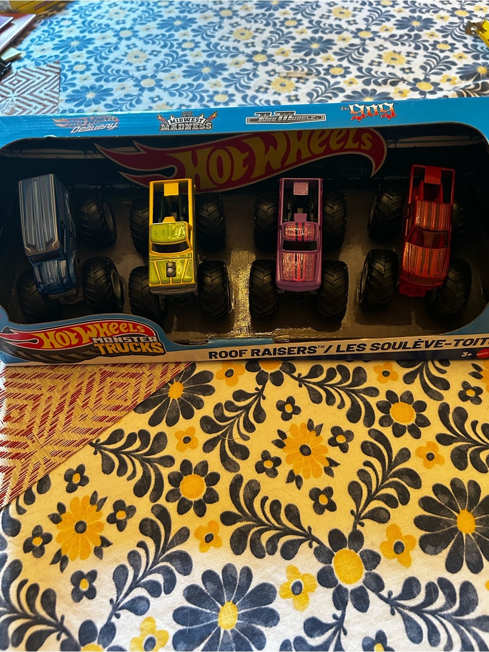 Hot Wheels Monster Trucks Roof Raisers 4-Pack — Blue, Yellow, Pink, Red